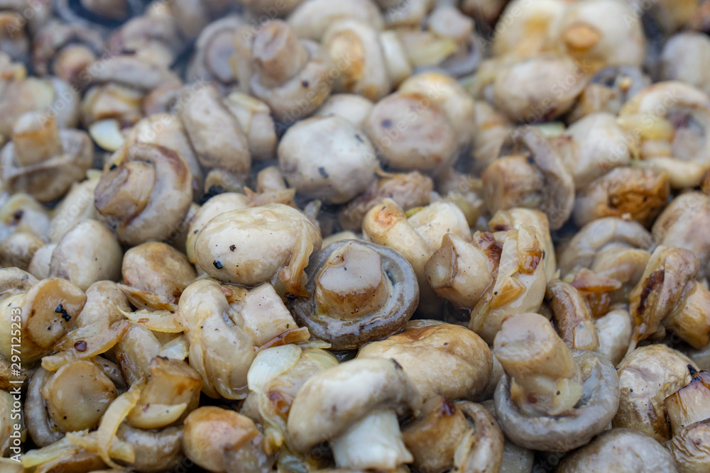Mushroom fried in a pan with sunflower oil and onion Mushroom fried in a pan with sunflower oil and onion