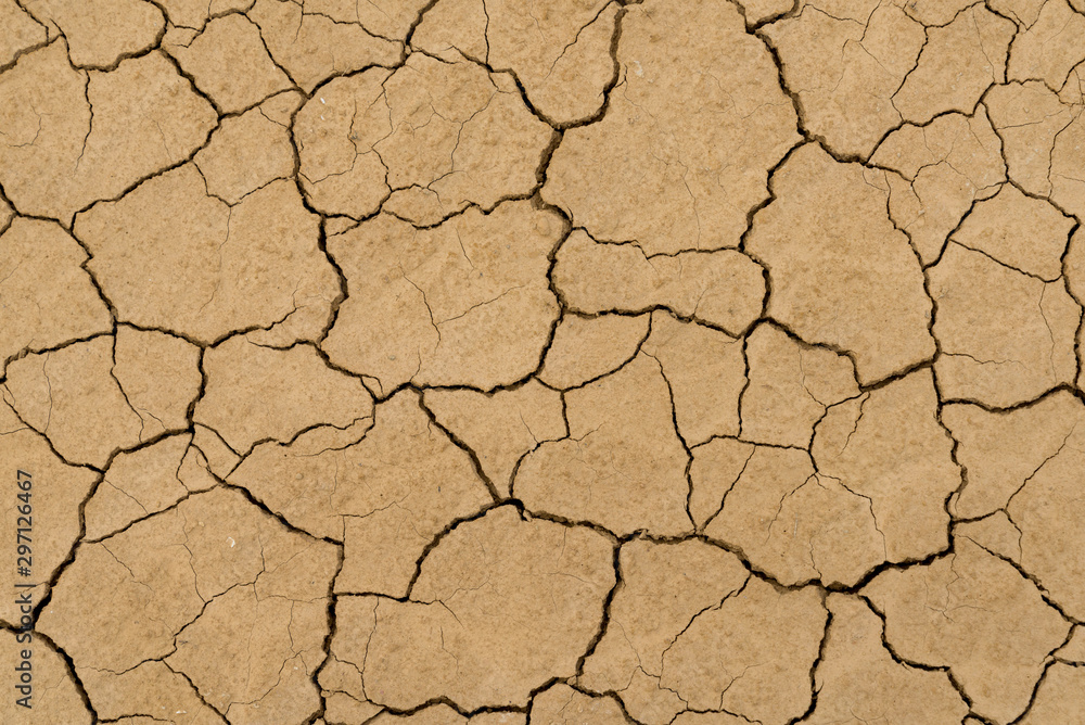 Clay sandy earth parched and cracked Clay sandy earth parched and cracked