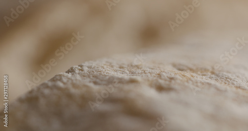 Extreme closeup of cutting ciabatta bread © GCapture