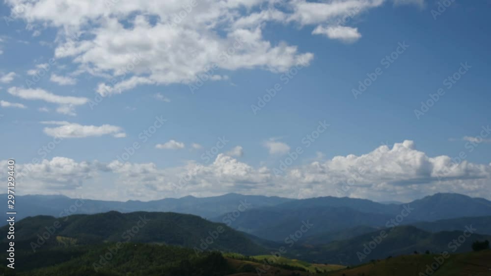 Aerial time lapse in movement of white clouds in the clear sky, over the complex mountains, fog and rice fields on morning, is beautiful nature background Aerial time lapse in movement of white clouds in the clear sky, over the complex mountains, fog and rice fields on morning, is beautiful nature background