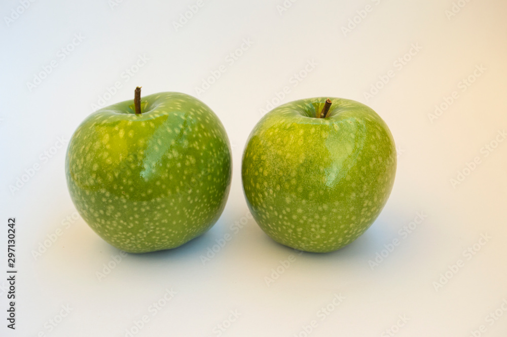 two green granny smith apples isolated on white background two green granny smith apples isolated on white background