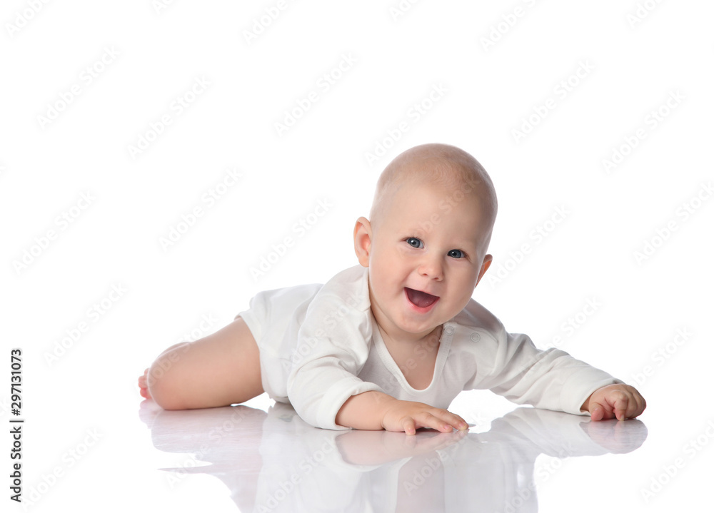 Infant child baby boy toddler lying in white shirt happy smiling isolated on a white Infant child baby boy toddler lying in white shirt happy smiling isolated on a white