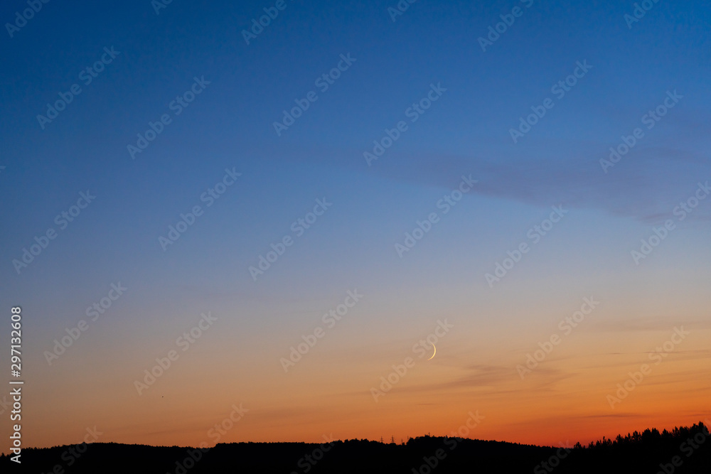 Colorful clear sky with no clouds at dusk after sunset.
