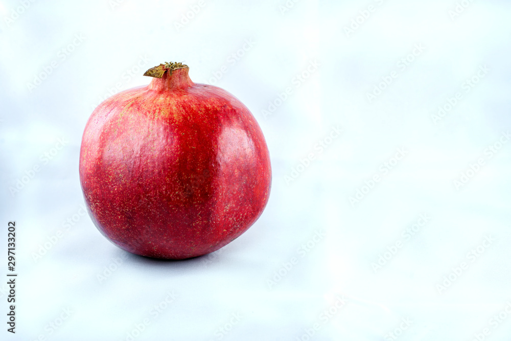Juicy Ripe Pomegranate Isolated On White Background. Pomegranate isolated on white background. There is a place for text. Healthy food concept. Juicy Ripe Pomegranate Isolated On White Background. Pomegranate isolated on white background. There is a place for text. Healthy food concept.