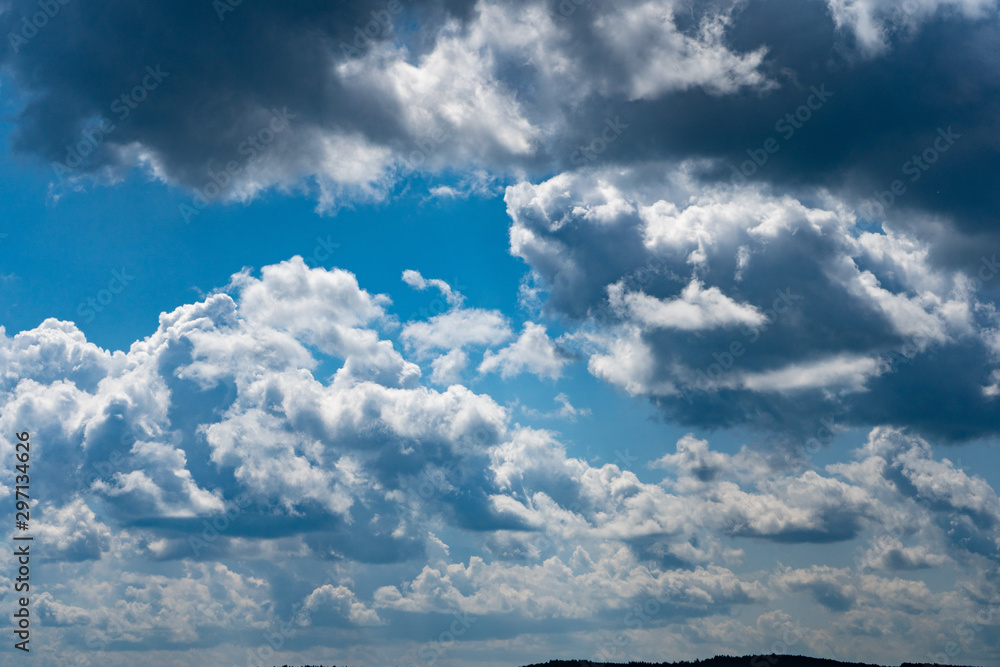 Glowing clouds on a background of blue sky. White fluffy luminous cloud Glowing clouds on a background of blue sky. White fluffy luminous cloud