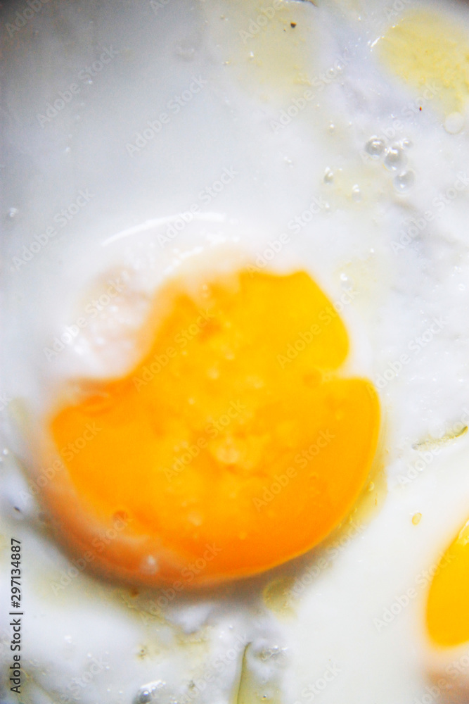 Roasted eggs on the black pan closeup Roasted eggs on the black pan closeup