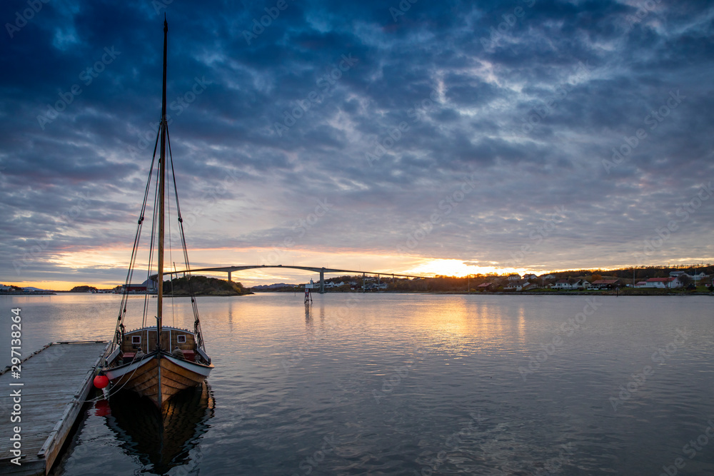 Old Nordland's boat at the quay in sunset at Brønnøysund Bridge, Nordland county,Europe