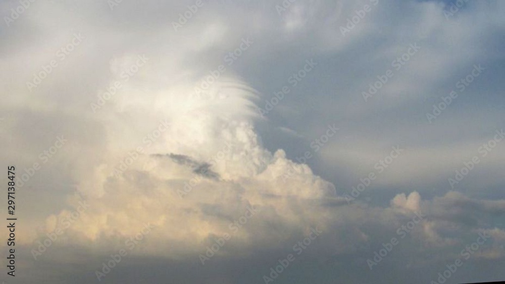 distance view of a thundercloud above the sea