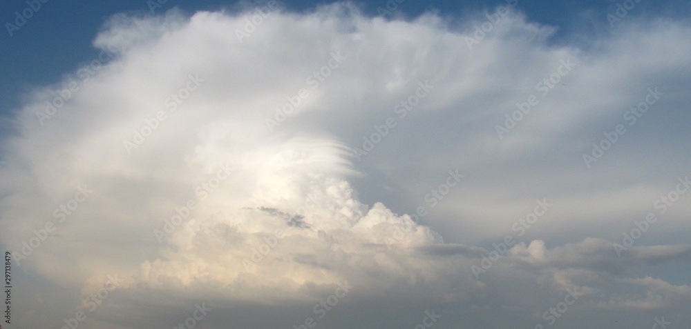 blue sky in a bowl of white clouds after a thunderstorm