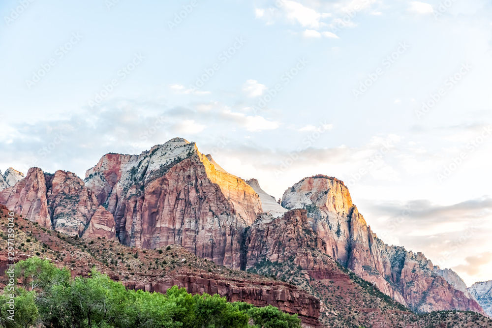 Zion National Park in Utah with landscape view of sunrise sky at red rock cliffs near Watchman Campground and Visitor Center