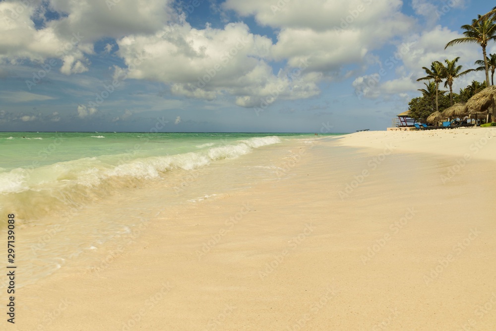 Amazing beauty white sand beach of Aruba Island. Turquoise sea water and blue sky. Beautiful background