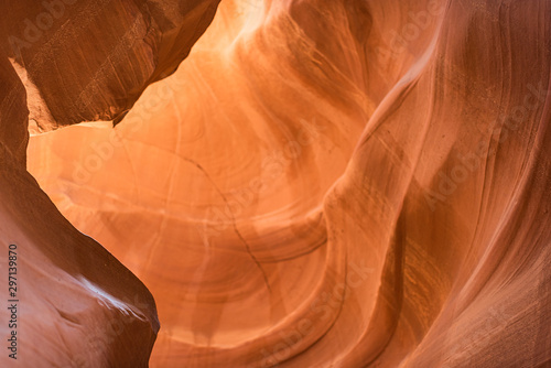 Abstract view of yellow orange light at upper Antelope slot canyon with wave shape rock sandstone in Page, Arizona