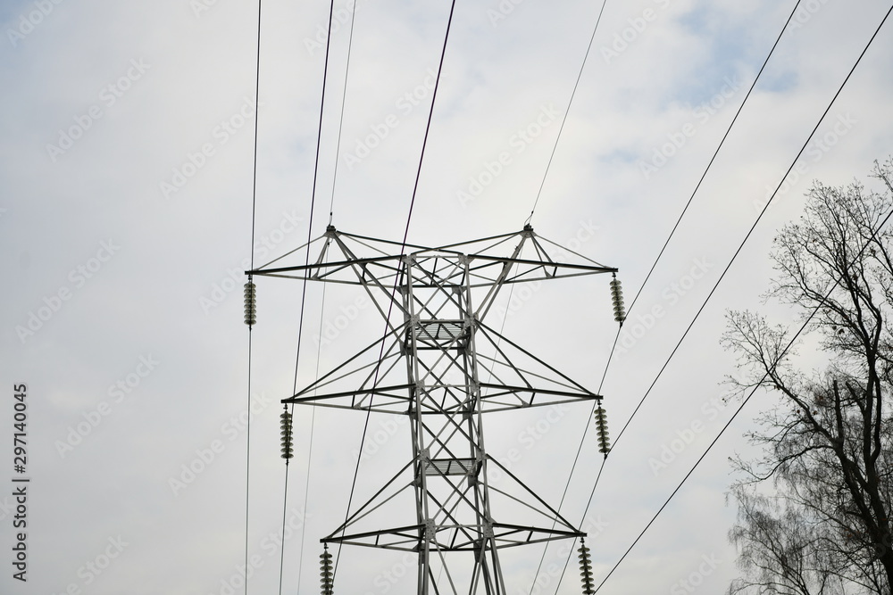 high voltage farm against gray sky