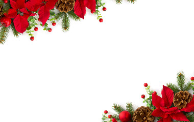 Christmas decoration. Frame of flowers of red poinsettia, branch christmas tree, ball, red berry on a white background with space for text. Top view, flat lay