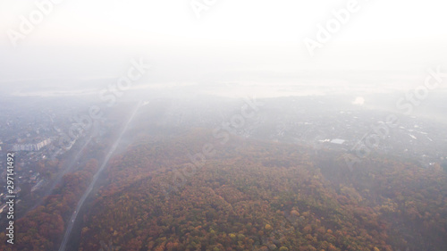 Autumn forest aerial view at sunset. © sergeytay