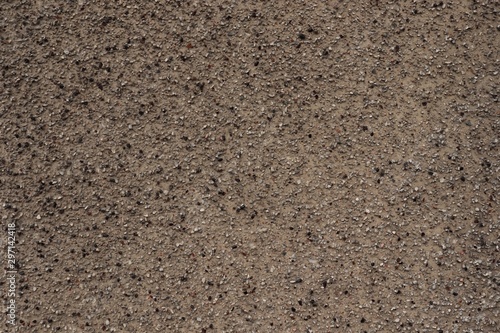 Lumpy surface texture, small pebbles.