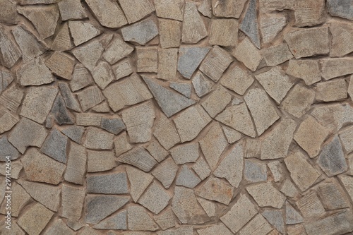 Paving slabs of irregular shape and different sizes.