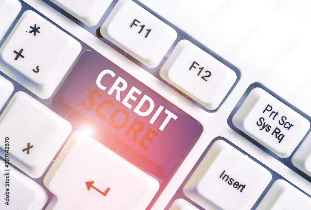 Writing note showing Credit Score. Business concept for Represent the creditworthiness of an individual Lenders rating White pc keyboard with note paper above the white background Writing note showing Credit Score. Business concept for Represent the creditworthiness of an individual Lenders rating White pc keyboard with note paper above the white background
