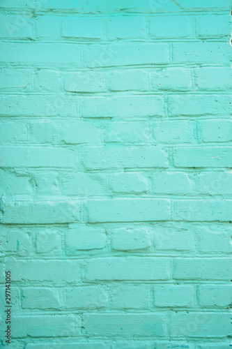 Vertical teal turquoise or aqua mint green brick wall background. 