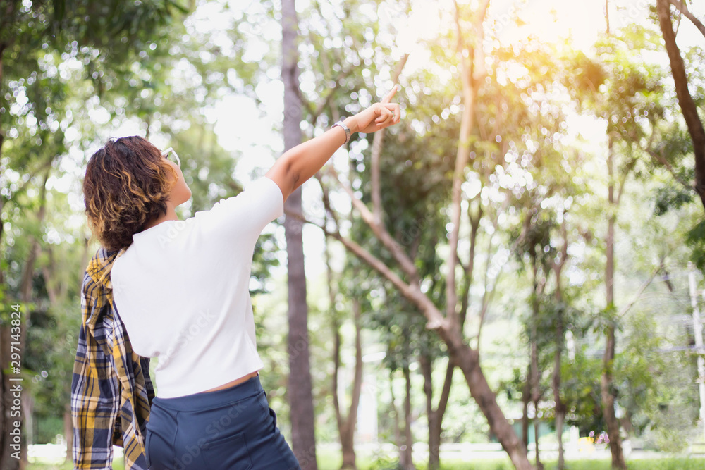 Young woman raise hands up for her success, Concept of Success in life. Young woman raise hands up for her success, Concept of Success in life.