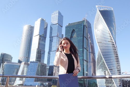 Businesswoman at skyscraper background