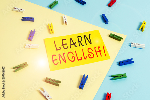 Text sign showing Learn English. Business photo text gain acquire knowledge in new language by study Colored clothespin paper empty reminder yellow blue floor background office