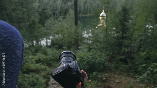 Wallpaper Mural Traveler photographing scenic view in forest. One caucasian woman shooting nice magic look. Girl take photo video on dslr mirrorless camera. Torontodigital.ca