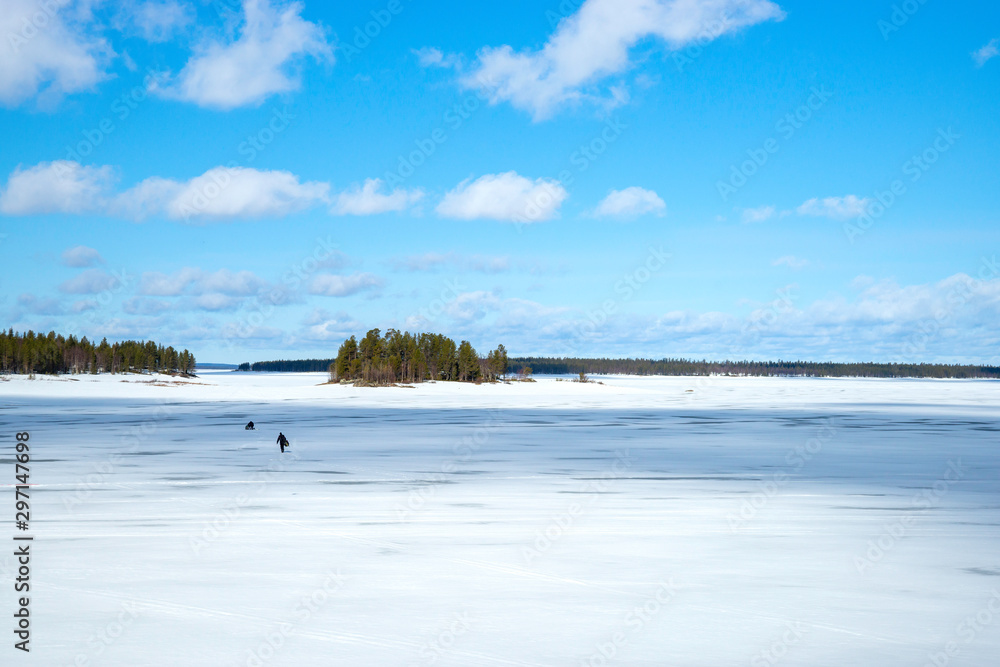 Landscape of remote ice fishing in Lapland, Finland