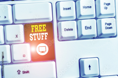 Text sign showing Free Stuff. Business photo text Any thing that you can have in a store that is not being paid White pc keyboard with empty note paper above white background key copy space