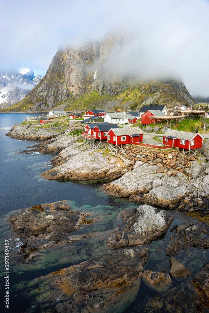 Hamnoy fishing village with red houses in Norwegian fjord. Lofoten Islands, Norway