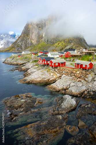 Hamnoy fishing village with red houses in Norwegian fjord. Lofoten Islands, Norway