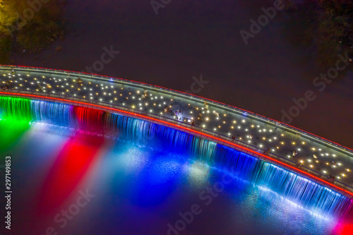 Aerial view of Starlight Bridge or Anh Sao Bridge which is a pedestrian bridge with colored lights and waterfall in District 7 of Ho Chi Minh City also known as Saigon  Vietnam. 