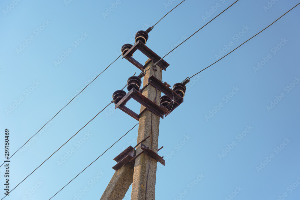 Power lines with various poles and supports, the appearance of an electrical transformer booth. Power lines with various poles and supports, the appearance of an electrical transformer booth.