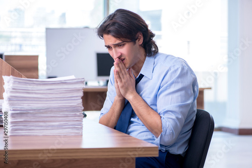 Young employee unhappy with excessive work