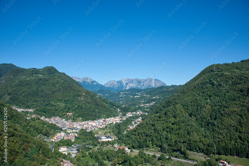  little town  at the foot of mountain range: Piccole Dolomiti - Italy