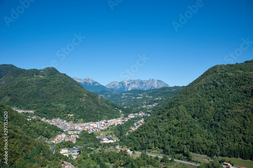  little town  at the foot of mountain range  Piccole Dolomiti - Italy