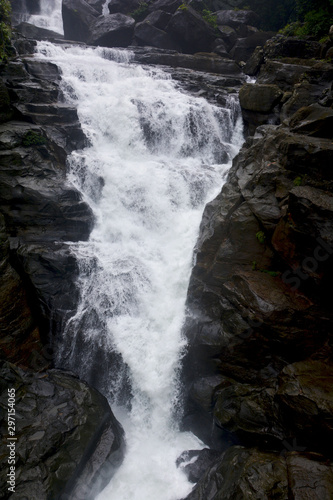 Close up of waterfall in Shillong in motion blurr and rocks, selective focusing