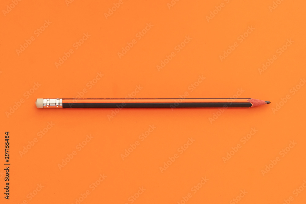 Wooden Pencil on Orange Background Dividing Space Into Halves - obrazy, fototapety, plakaty 