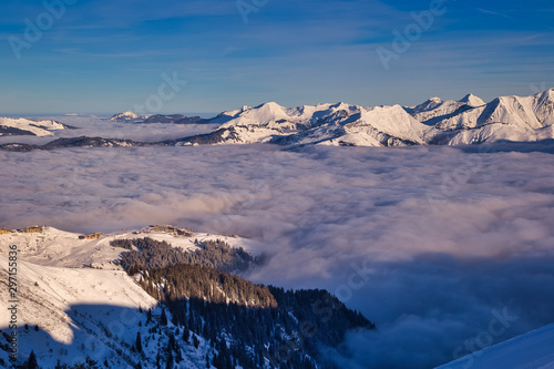 Inversion in valley and illuminated mountain peaks