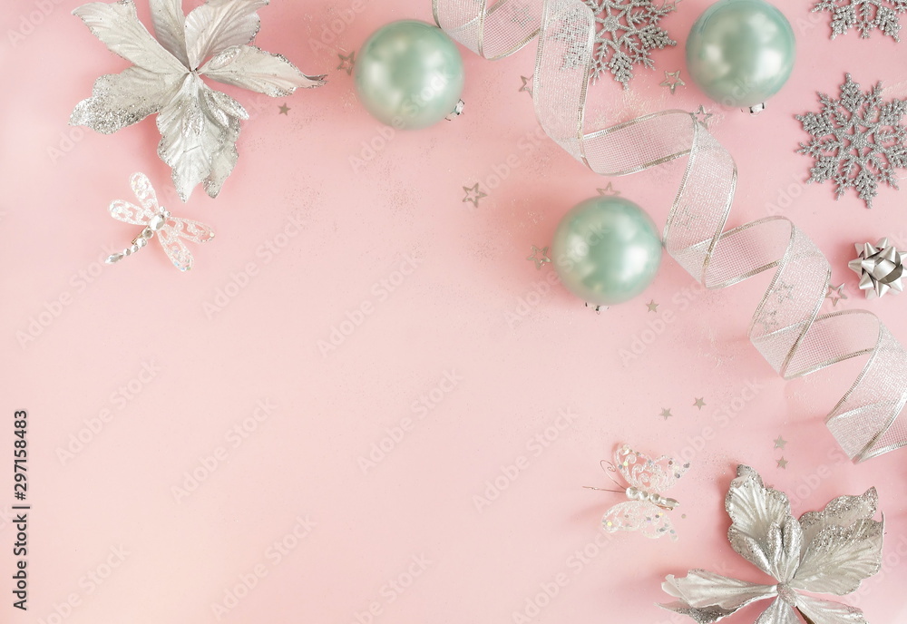 Christmas background. Xmas or new year white silver color decorations on pastel pink background with empty copy space for text. holiday and celebration concept for postcard or invitation. top view Christmas background. Xmas or new year white silver color decorations on pastel pink background with empty copy space for text. holiday and celebration concept for postcard or invitation. top view