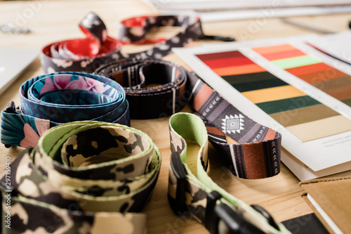 Set of rolled decorative pet collars and samples of textile