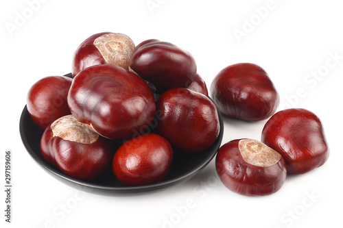 chestnuts in a black plate isolated on white background