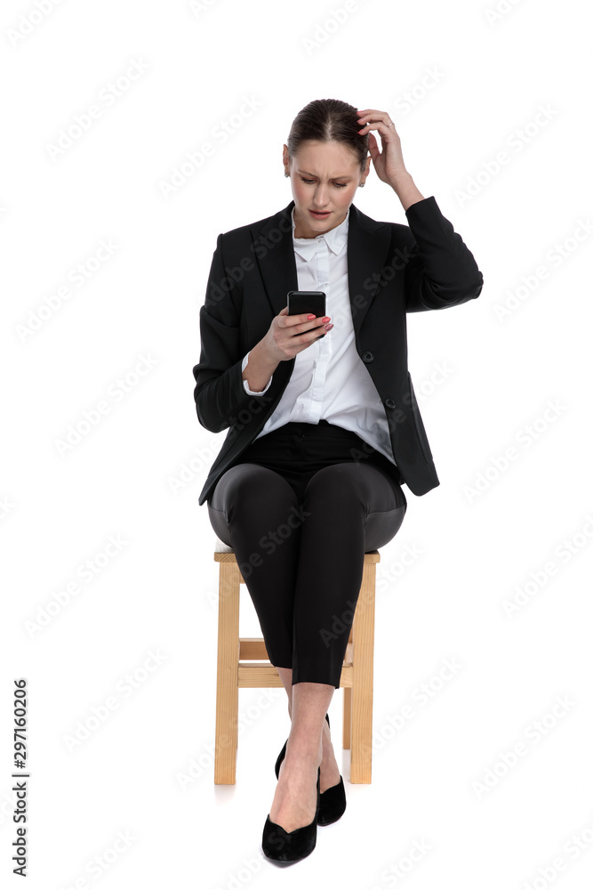 businesswoman reading email on phone confused businesswoman reading email on phone confused