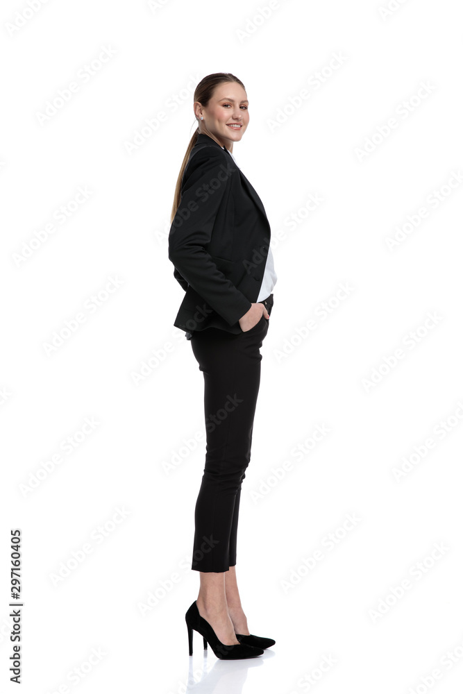 businesswoman standing and waiting in line while looking at camera businesswoman standing and waiting in line while looking at camera