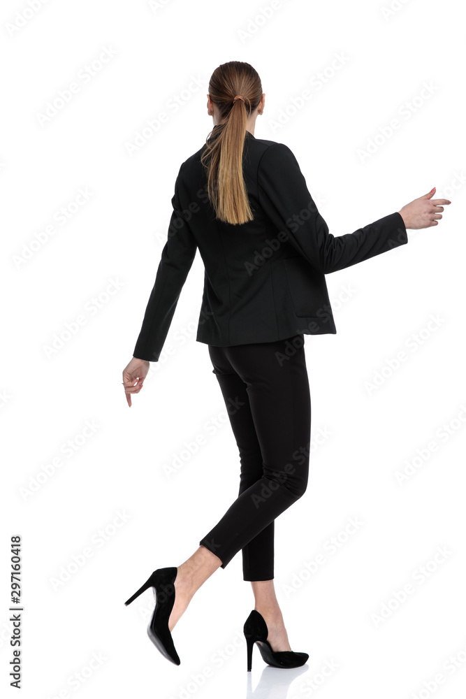 businesswoman standing and posing with hands loose businesswoman standing and posing with hands loose
