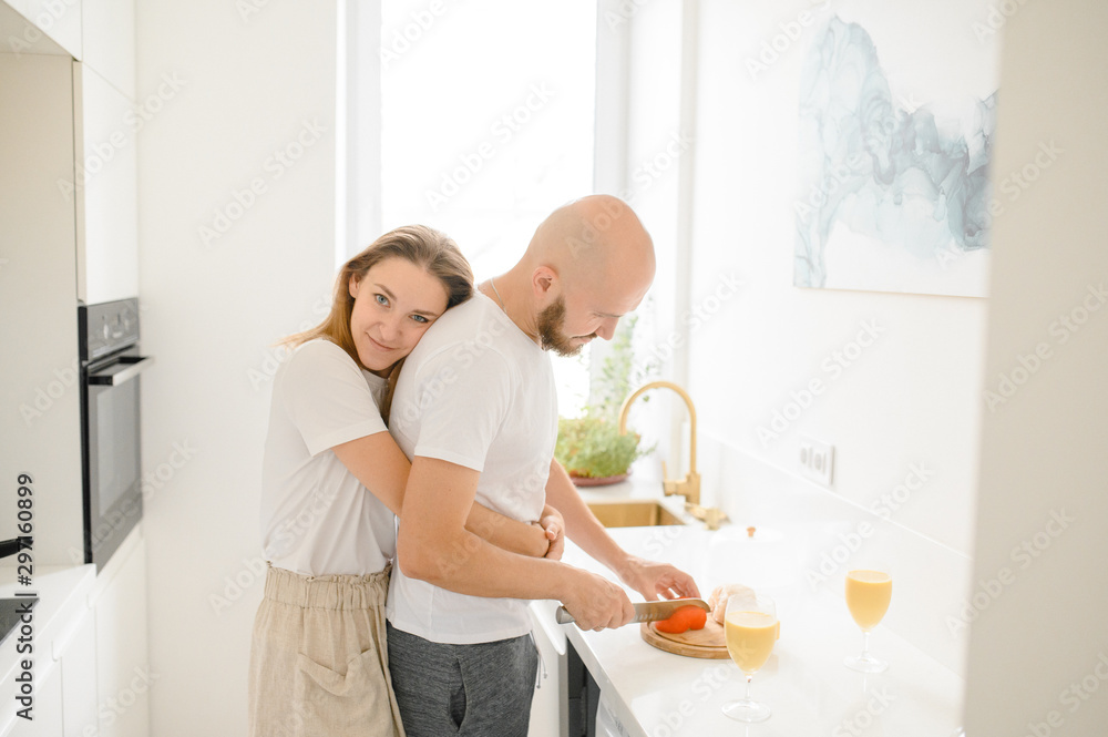 young couple making Breakfast in the morning. Young family. relationship young couple making Breakfast in the morning. Young family. relationship