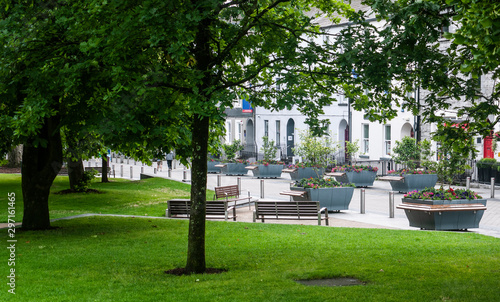 View of Eyre Square, Galway City on a quiet summer morning showing the surrounding flora and buildings