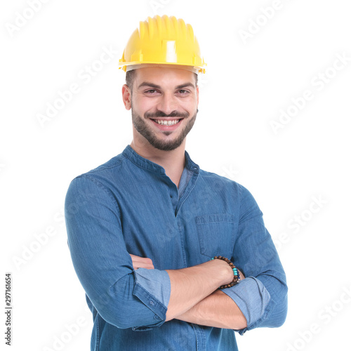 Delighted casual man smiling with his arms crossed