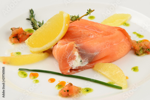 salmon with lemon and parsley on plate