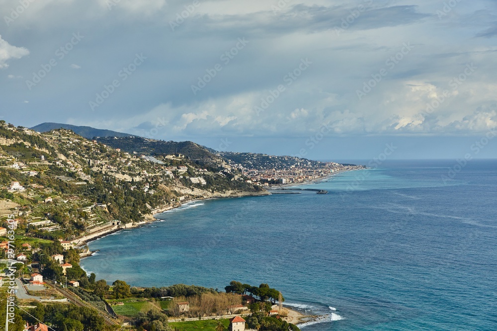 Mediterranean coastal landscape in Northern Italy Riviera, view of Ventimigla, town by the French border